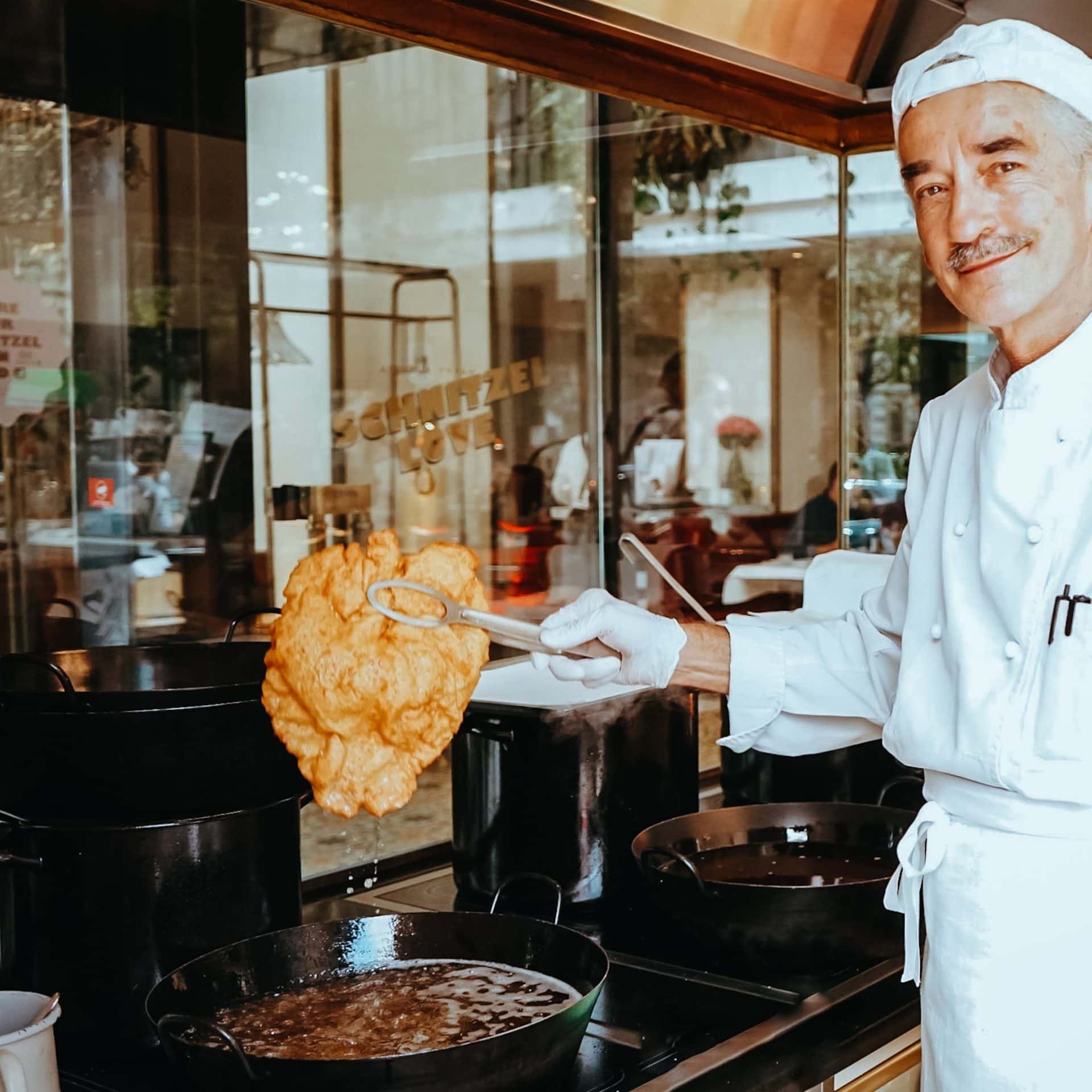 Schnitzel cook in a kitchen