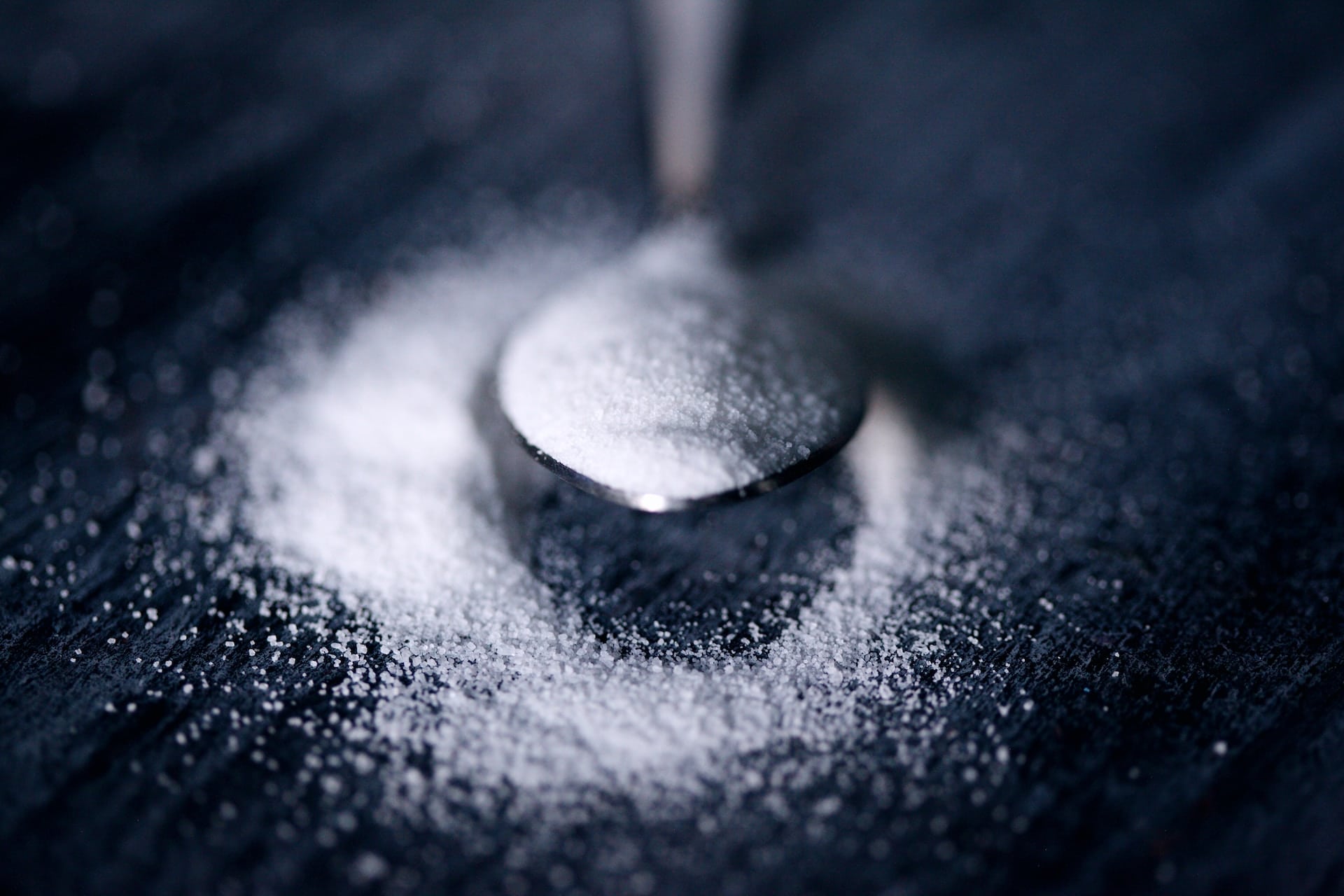 Spoon in a pile of sugar